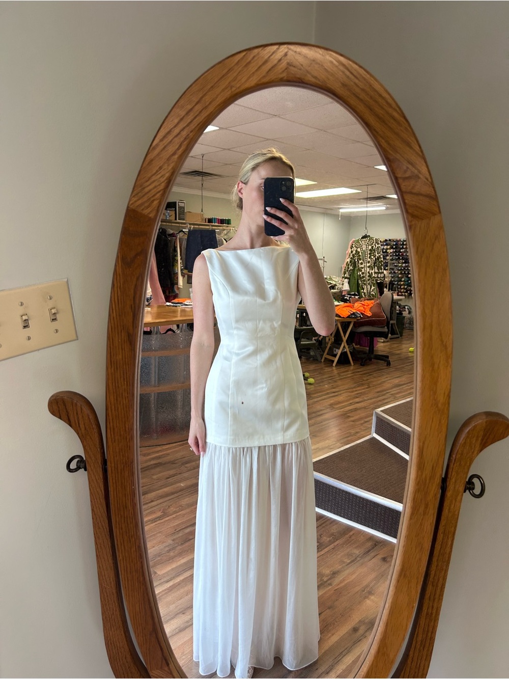 Elegant White Sleeveless Wedding Gown with Sheer Skirt